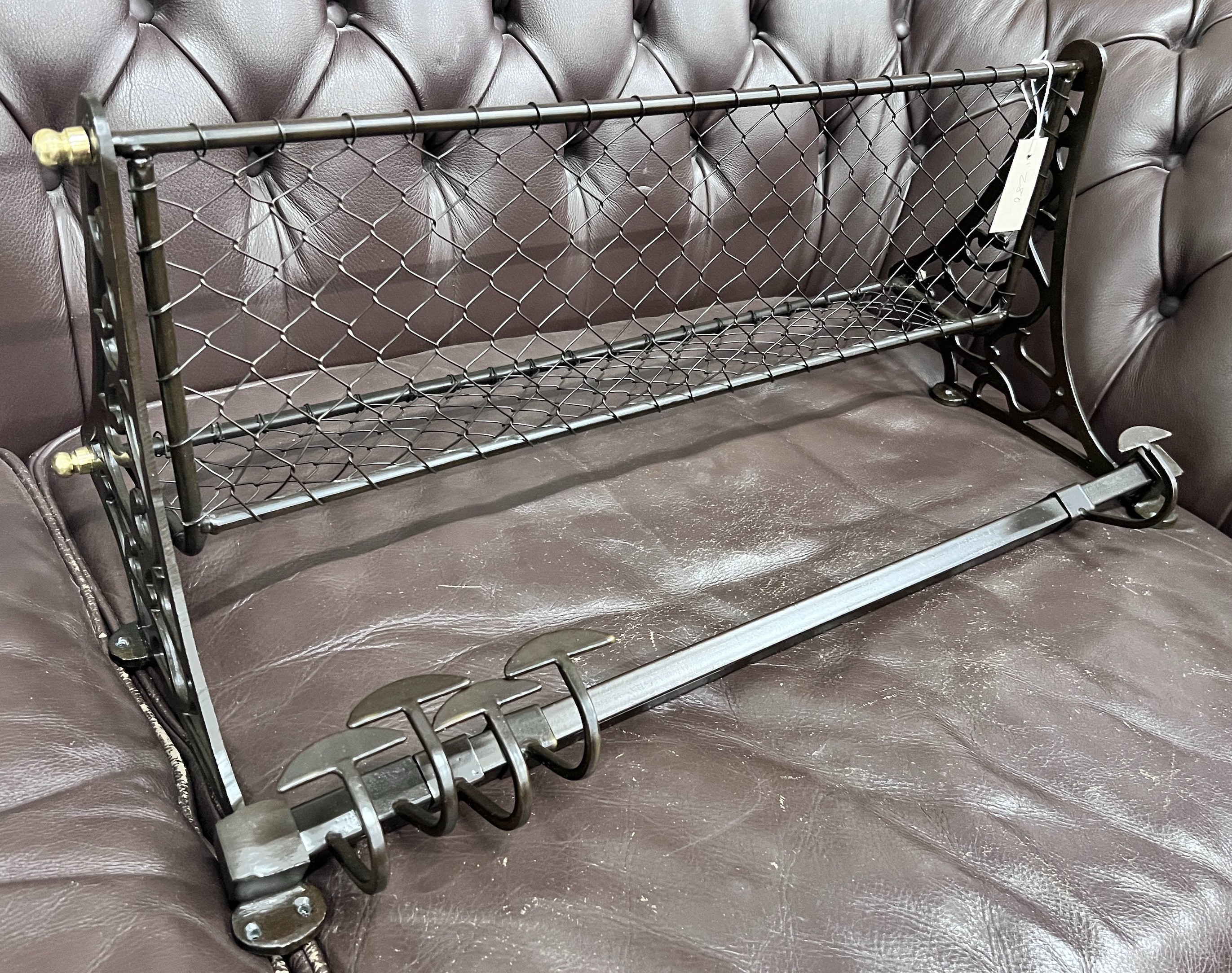 A bronzed metal wall hanging coat rack, width 75cm *Please note the sale commences at 9am.